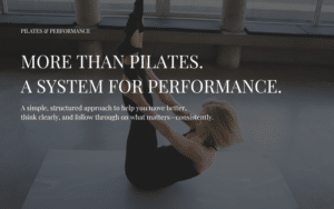 Woman performing a Pilates exercise on a mat, representing the Pilates Performance System for strength and clarity